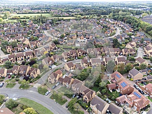 Aerial shot looking down on urban housing development - housing estate of mainly bungalows in Milton Keynes. Housing market, econo