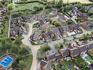 Aerial shot looking down on urban housing development - housing estate of mainly bungalows in Milton Keynes. Housing market, econo