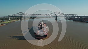 Aerial shot of Mississippi River waterfront and bridge in New Orleans, Louisiana