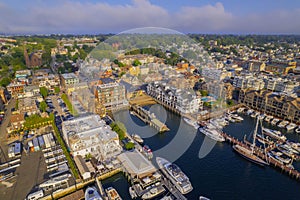 Aerial shot of the Newport Harbor in Rhode Island with ducked boats and a landscape