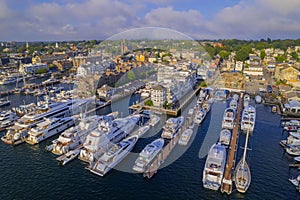Aerial shot of the Newport Harbor in Rhode Island with ducked boats and a landscape