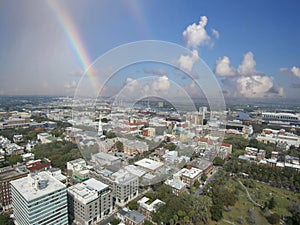 Aerial shot of the office buildings, apartments and shops in the city skyline along the Savannah River with with lush green trees