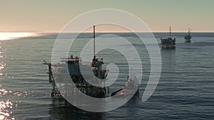 Aerial shot of Oil Gas Pacific Ocean drilling Platform Rig on California