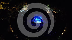 Aerial shot of people watching a concert at an open-air theater