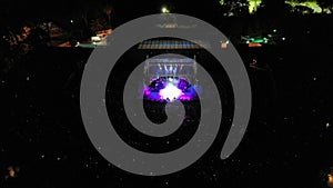 Aerial shot of people watching a concert at an open-air theater