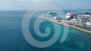 Aerial shot of a pier with cruise liners and a barge and sailing boat Bridgetown, Barbados