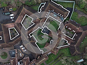 Aerial shot of the Ravenswood Hospital in a village during the day in Hampshire, United Kingdom