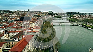 Aerial shot of road traffic on embankment of the River Rhone in the centre of Lyon, France