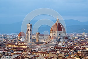 Aerial shot of the rooftops in Florence, Italy, with the Dome of Santa Maria del Fiore Cathedral