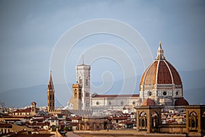 Aerial shot of the rooftops in Florence, Italy, with the Dome of Santa Maria del Fiore Cathedral