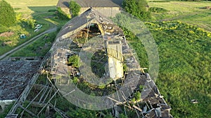 Aerial shot of a ruined soviet farm building.