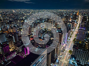 Aerial shot of Sao Paolo, Brazil at night with illumintaed buildings and streets