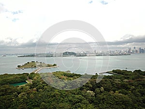 Aerial shot of the Singapore City from St John`s Island, one of the Southern Islands.