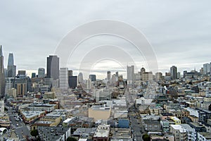 aerial shot of skyscrapers, hotels and office buildings in the city skyline, apartments, condos and cars on the street