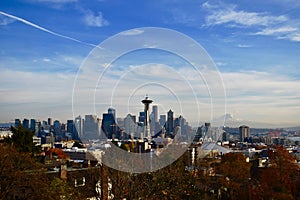 Aerial shot of the Space Needle in Seattle with Mount Rainier in the background