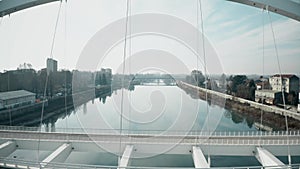 Aerial shot of the Tanaro river and bridge in Alessandria, Italy