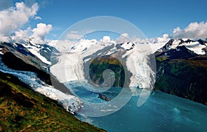 Aerial shot of three majestic glaciers calving into Prince William Sound. photo