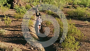 Aerial Shot of Trail Runners in Arizona Sonoran Desert Surrounded by Saguaros
