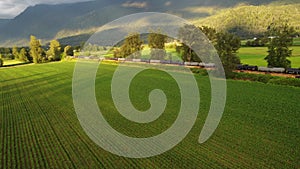 Aerial shot of a train traveling through the Chilliwack countryside