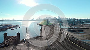 Aerial shot of a the trainyard and port facility with Downtown Vancouver in the background.