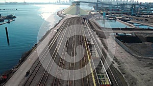 Aerial shot of a the trainyard and port facility with Downtown Vancouver in the background.