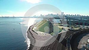 Aerial shot of a the trainyard and port facility with Downtown Vancouver in the background.