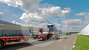 Aerial Shot of Truck with Attached Semi Trailer Leaving Industrial Warehouse