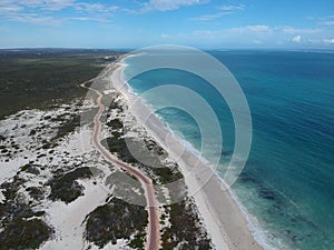 Aerial shot of the Turquoise Way coastal path in Australia with a blue skyscape