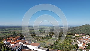 Aerial shot of the village housed and roofs under the clear sky