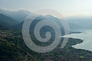 Aerial shot of the villages near to Lake Como and Alpine Mountains of Como, Italy