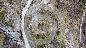 Aerial shot of the waterfall flowing over the rock at Offense, Austria