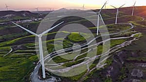 Aerial Shot of Windmills Producing Clean Energy in Mountainous Region