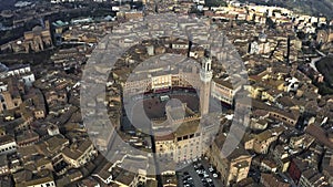 Aerial of Siena centre involving famous Piazza del Campo, one of Europe`s greatest medieval squares. Tuscany, Italy