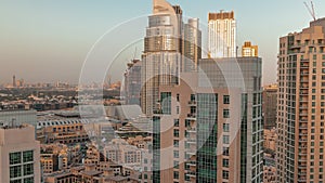 Aerial skyline of buildings in Downtown Dubai timelapse during sunset.