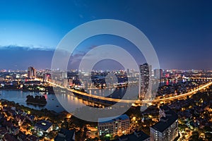 Aerial skyline view of Hanoi at Linh Dam lake, Belt Road No. 3. Hanoi cityscape by sunset period