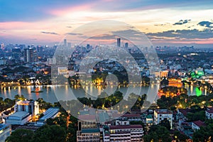 Aerial skyline view of Hoan Kiem lake or Ho Guom, Sword lake area at twilight. Hoan Kiem is center of Hanoi city. Hanoi cityscape.