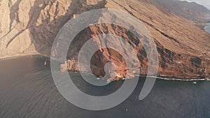 Aerial slider above coastline of mountain slope of island of El Hierro