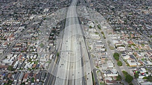 AERIAL: Slow Overhead Lookup over 110 Highway with little car traffic in Los Angeles, California on Cloudy Overcast Day