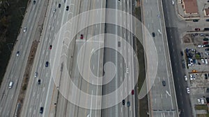 AERIAL: Slow Overhead Lookup over 110 Highway with little car traffic in Los Angeles, California on Cloudy Overcast Day