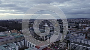 AERIAL: Slowly flying over Center of Berlin Germany with view on Bundestag, Reichstag at Sunset