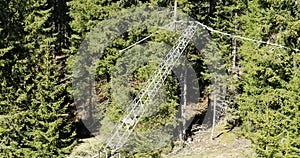 Aerial of snapped power line pole. Electricity Line leaning on trees after storm damage