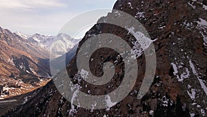 Aerial of snowy mountain range with snow