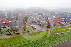 Aerial from the snowy village Wierum in the Netherlands near the Waddenzee