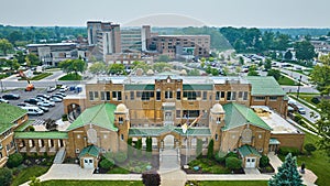 Aerial St Jude Catholic school with windows boarded up and under construction and Parkview hospital