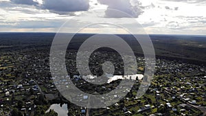 Aerial stock footage of countryside homes overlooking lake in summer Sunny day