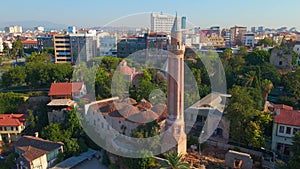 Aerial stock video, the iconic Yivli Minaret Mosque takes center stage in the heart of Antalya's historical