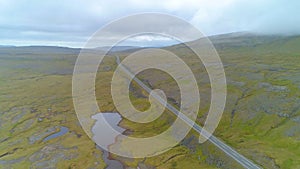 AERIAL: Straight road runs across the rugged terrain in mainland Faroe Islands.