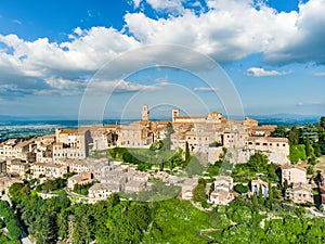 Aerial summer day view of Montepulciano town, located on top of a limestone ridge surrounded by vineyards. Vino Nobile wine