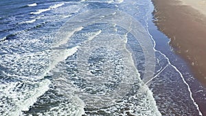 Aerial sun setting over sea ocean, tropical seascape coastline from above. On a summer evening on the seashore, a