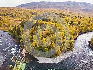 Aerial sunny fall autumn view of Abisko National Park, Kiruna Municipality, Lapland, Norrbotten County, Sweden, shot from drone,